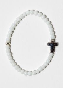 Rannekoru Ristin suojassa valkoinen